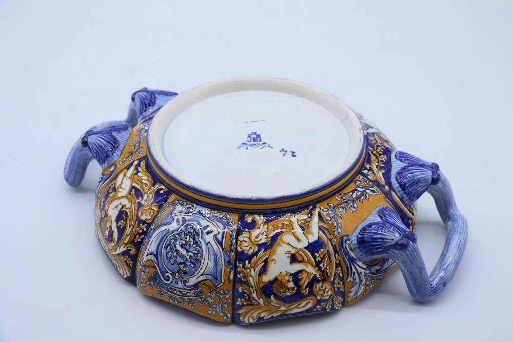 A hand-painted French Gien faience earthenware centrepiece dish with twin handles, decorated in cobalt blue and yellow mythological figures and acanthus scrollwork. View XXIII