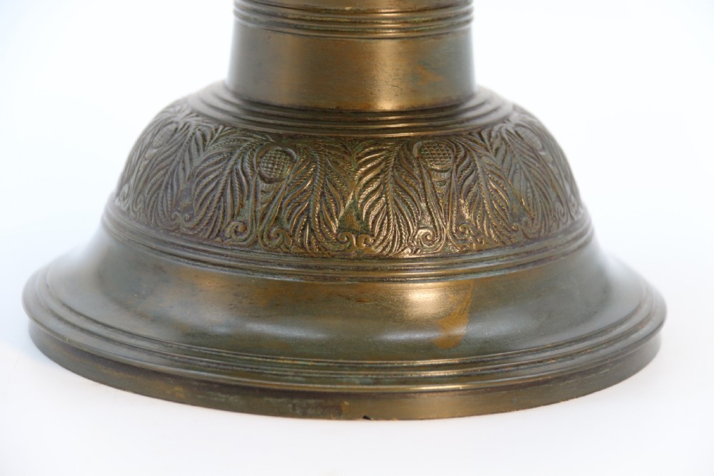 An antique nineteenth-century patinated bronze vase featuring hand-chased floral and foliate motifs, a bulbous center, flared neck, and circular base. View VI