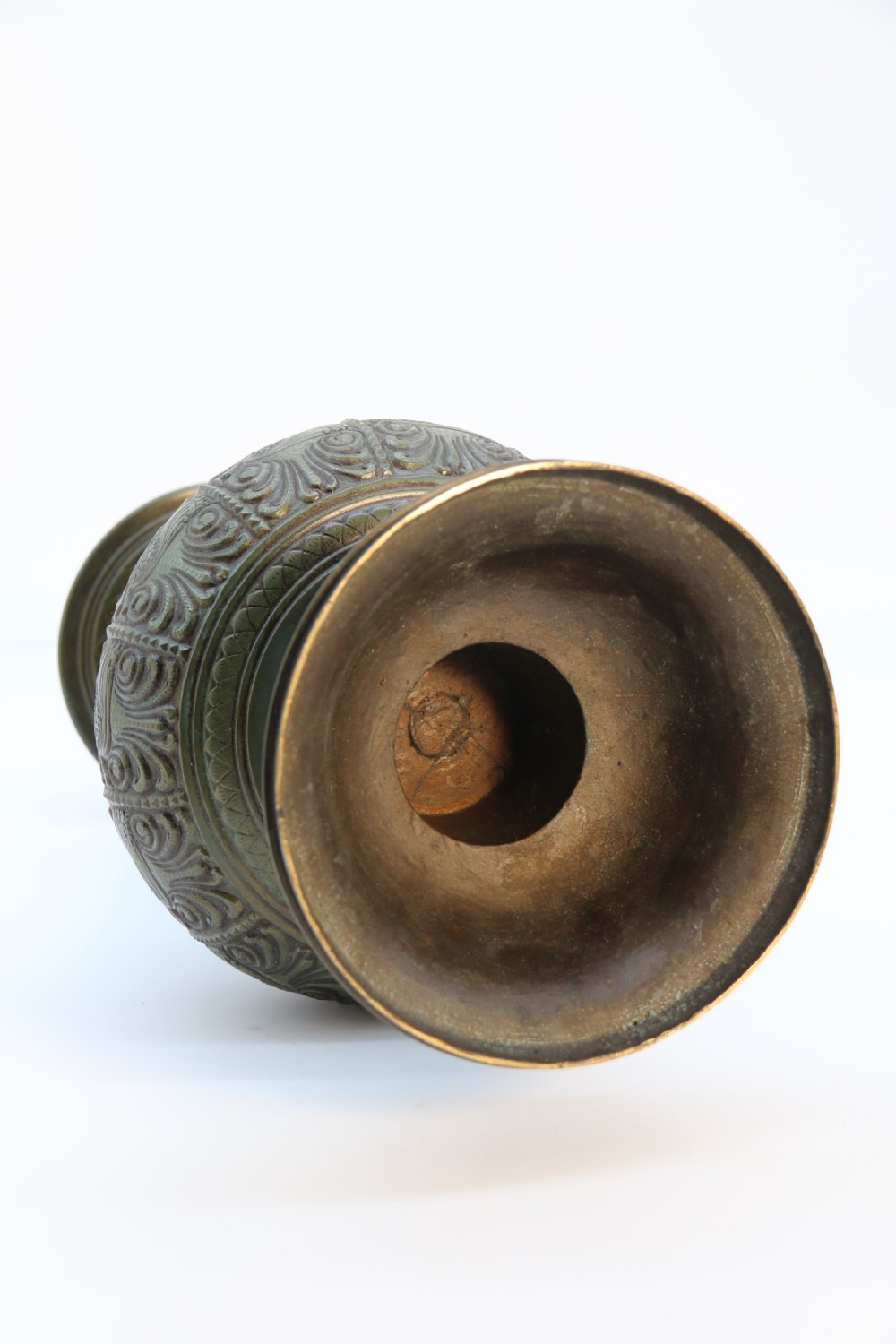 An antique nineteenth-century patinated bronze vase featuring hand-chased floral and foliate motifs, a bulbous center, flared neck, and circular base. View XVII