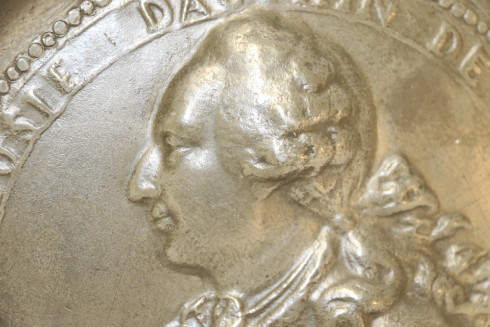 A pair of round silver grey pewter plates featuring raised profile relief portraits of Marie Antoinette and Louis XVI with beaded outer borders. View XI