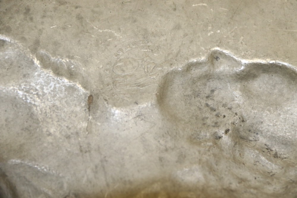 A pair of round silver grey pewter plates featuring raised profile relief portraits of Marie Antoinette and Louis XVI with beaded outer borders. View XII