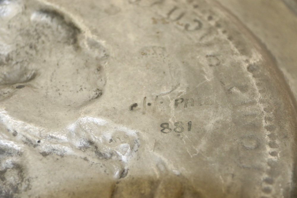 A pair of round silver grey pewter plates featuring raised profile relief portraits of Marie Antoinette and Louis XVI with beaded outer borders. View XIV
