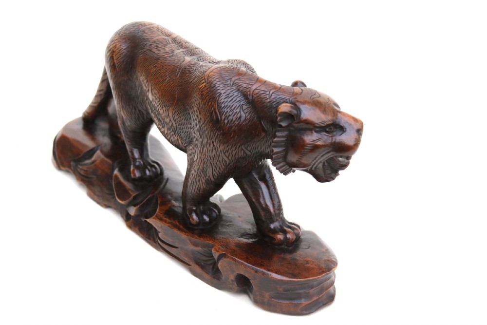 Antique Japanese Meiji period carved hardwood okimono of a prowling tiger. View III