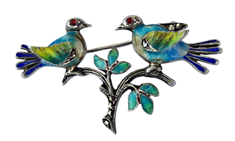 A delightful 1920s lovebirds silver and enamel marcasite set brooch