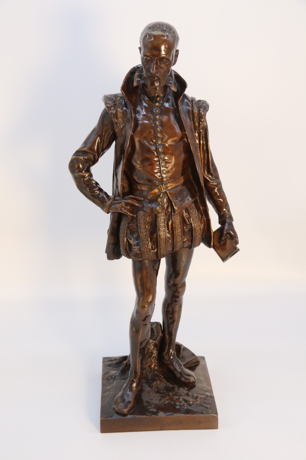 A 19th-century dark patinated bronze figure depicting French poet Joachim de Bellay in 16th-century period costume. View III