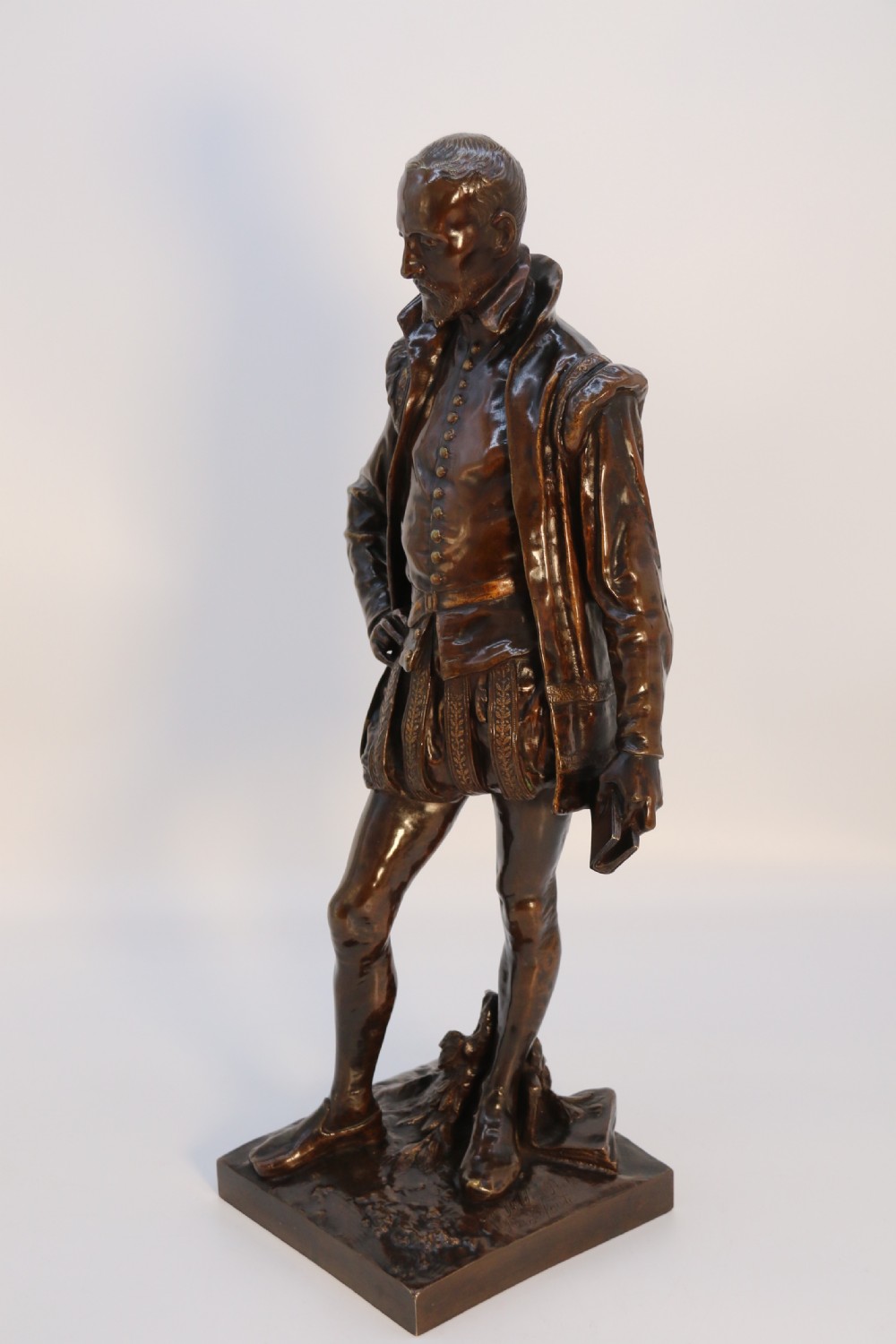 A 19th-century dark patinated bronze figure depicting French poet Joachim de Bellay in 16th-century period costume. View V