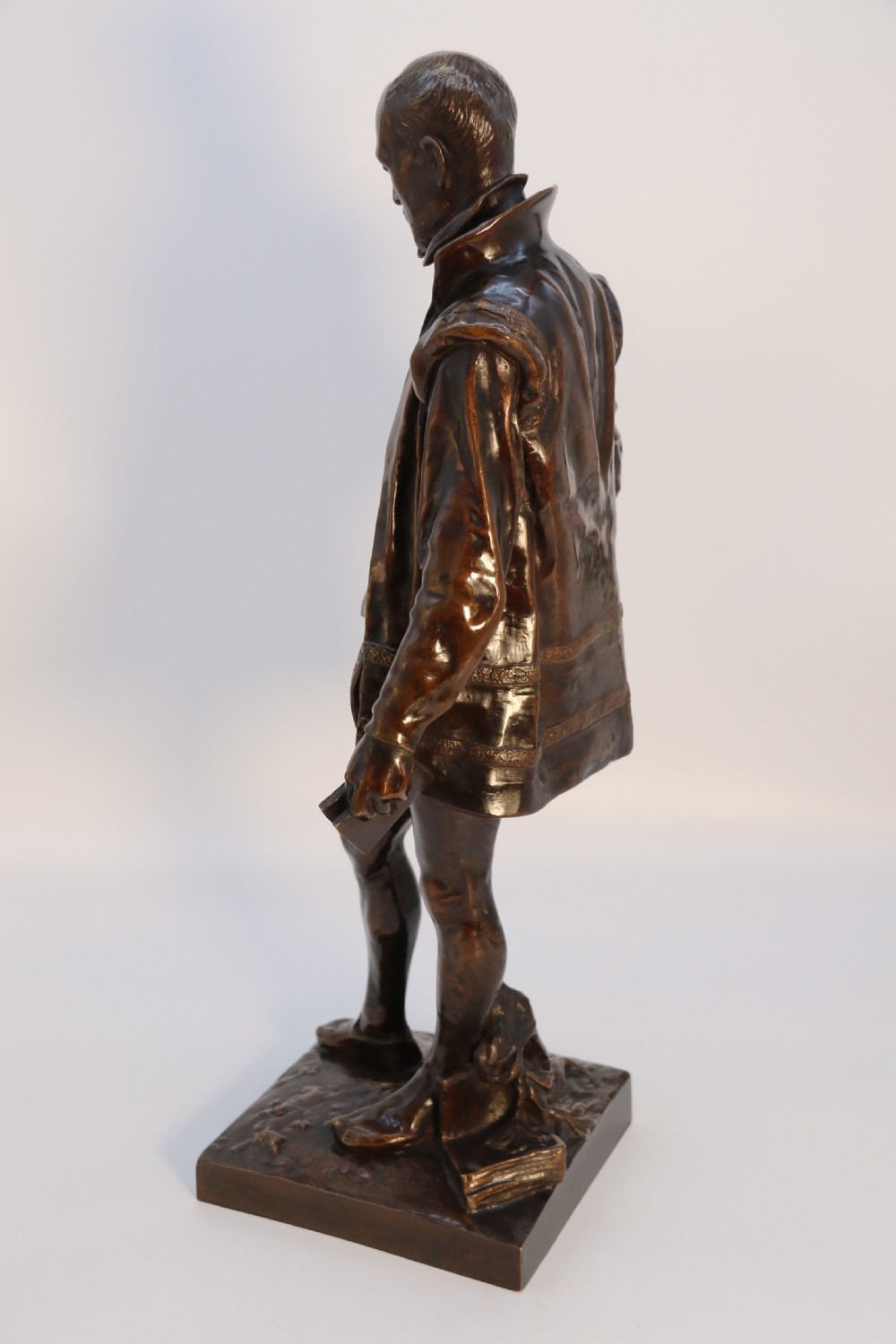 A 19th-century dark patinated bronze figure depicting French poet Joachim de Bellay in 16th-century period costume. View VI