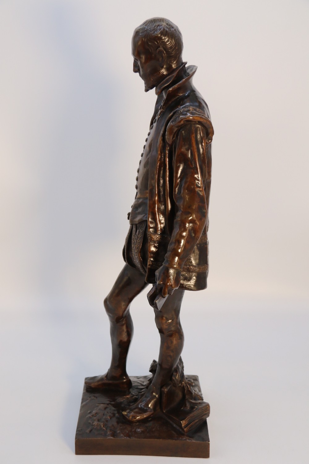 A 19th-century dark patinated bronze figure depicting French poet Joachim de Bellay in 16th-century period costume. View VII