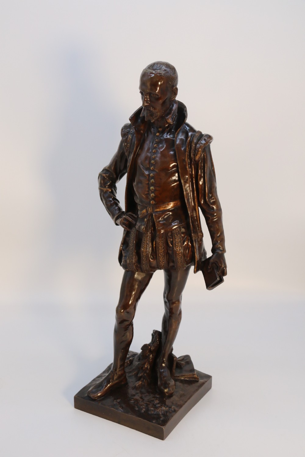 A 19th-century dark patinated bronze figure depicting French poet Joachim de Bellay in 16th-century period costume. View VIII