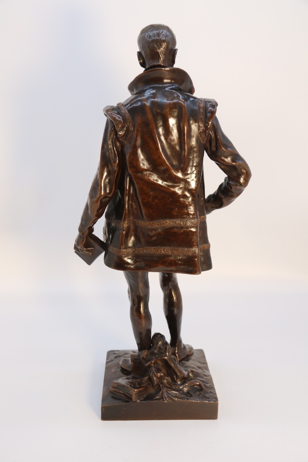 A 19th-century dark patinated bronze figure depicting French poet Joachim de Bellay in 16th-century period costume. View IX