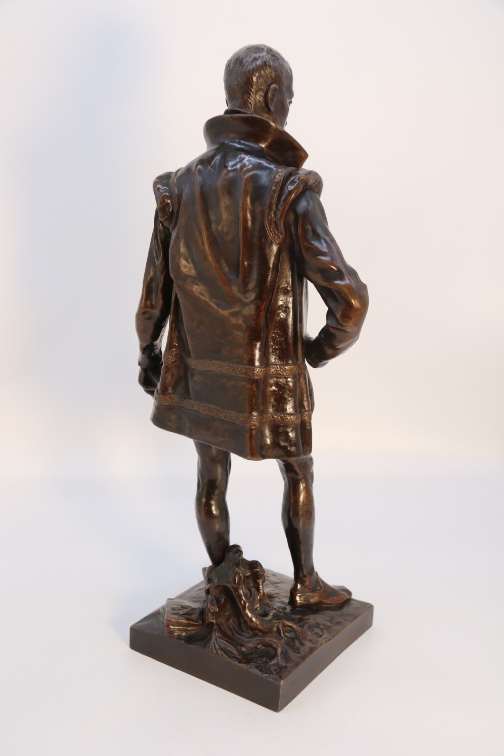 A 19th-century dark patinated bronze figure depicting French poet Joachim de Bellay in 16th-century period costume. View X