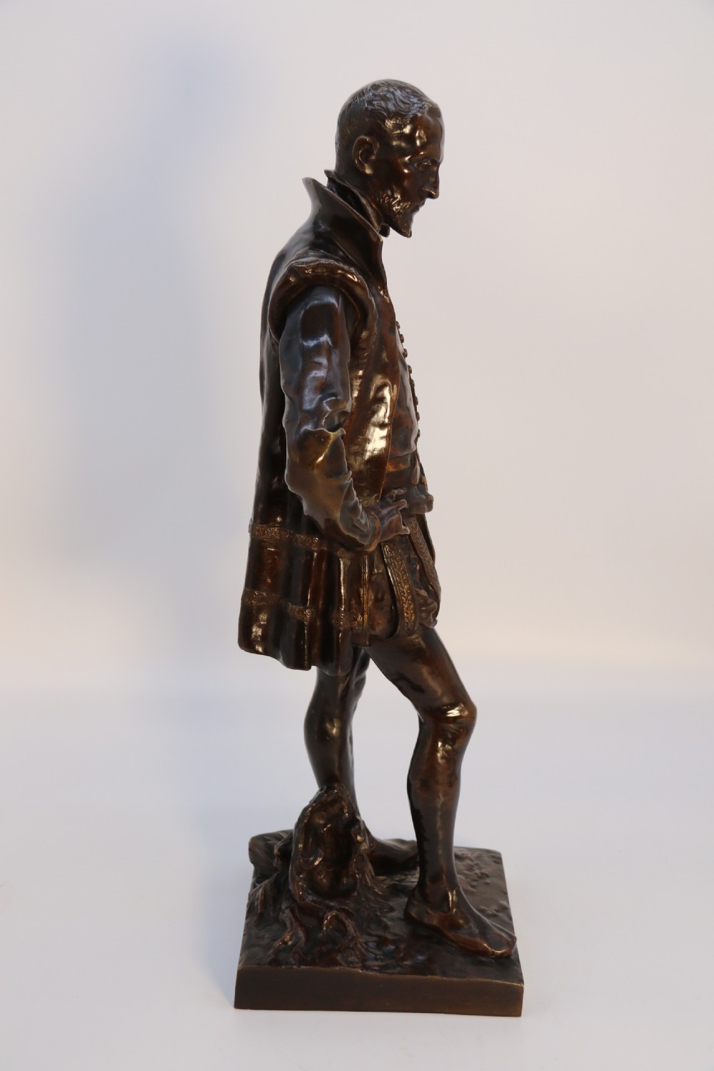 A 19th-century dark patinated bronze figure depicting French poet Joachim de Bellay in 16th-century period costume. View XI