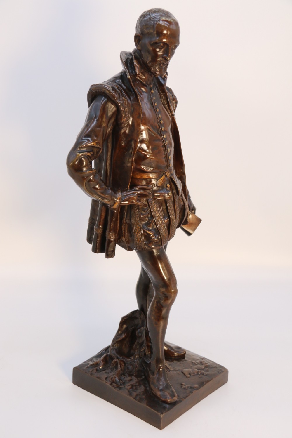 A 19th-century dark patinated bronze figure depicting French poet Joachim de Bellay in 16th-century period costume. View XII