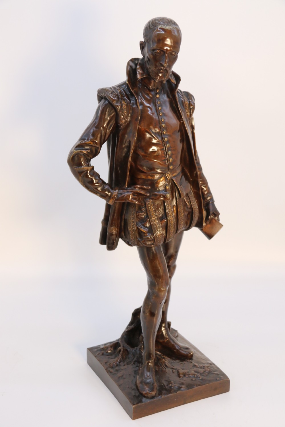 A 19th-century dark patinated bronze figure depicting French poet Joachim de Bellay in 16th-century period costume. View XIII