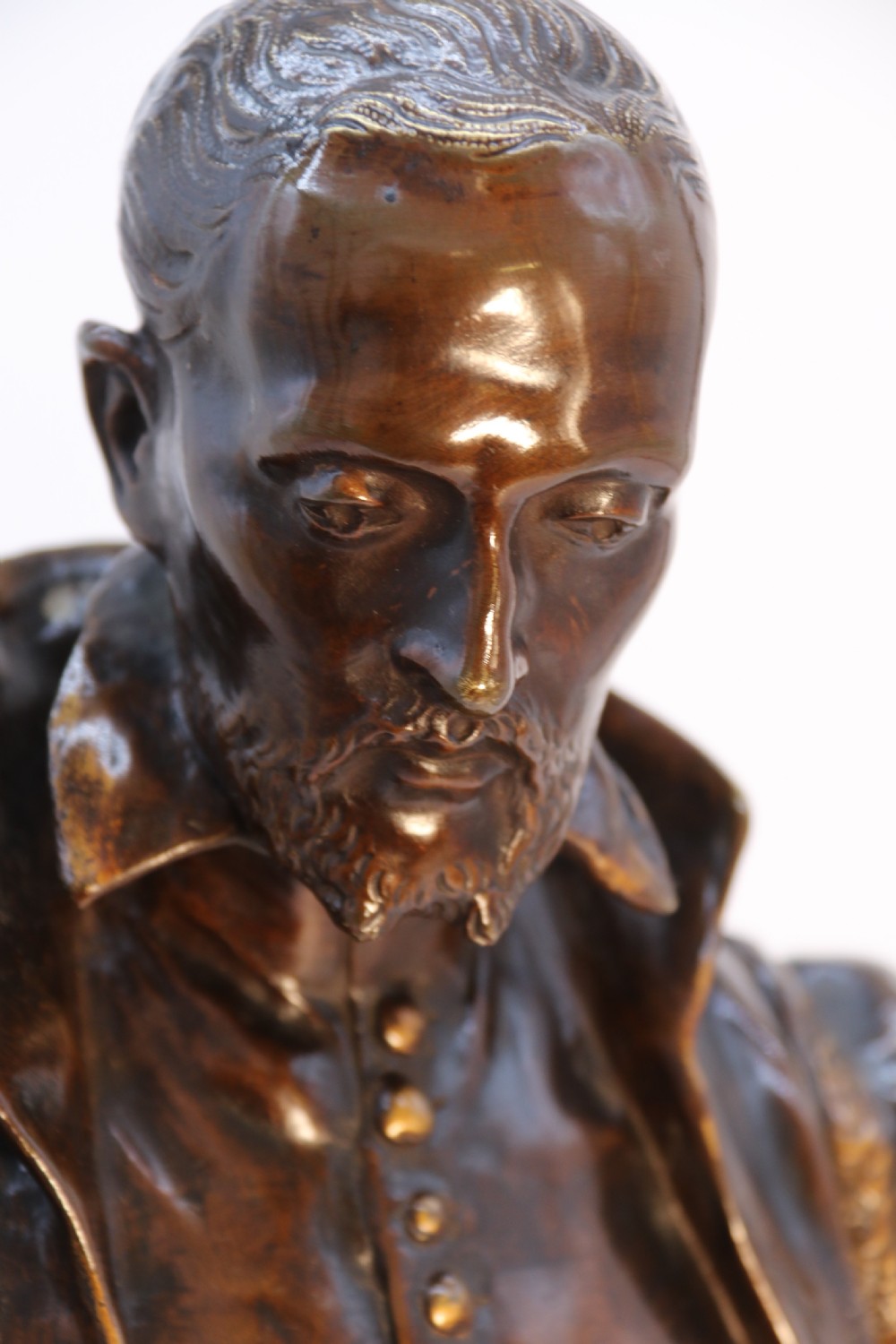 A 19th-century dark patinated bronze figure depicting French poet Joachim de Bellay in 16th-century period costume. View XV
