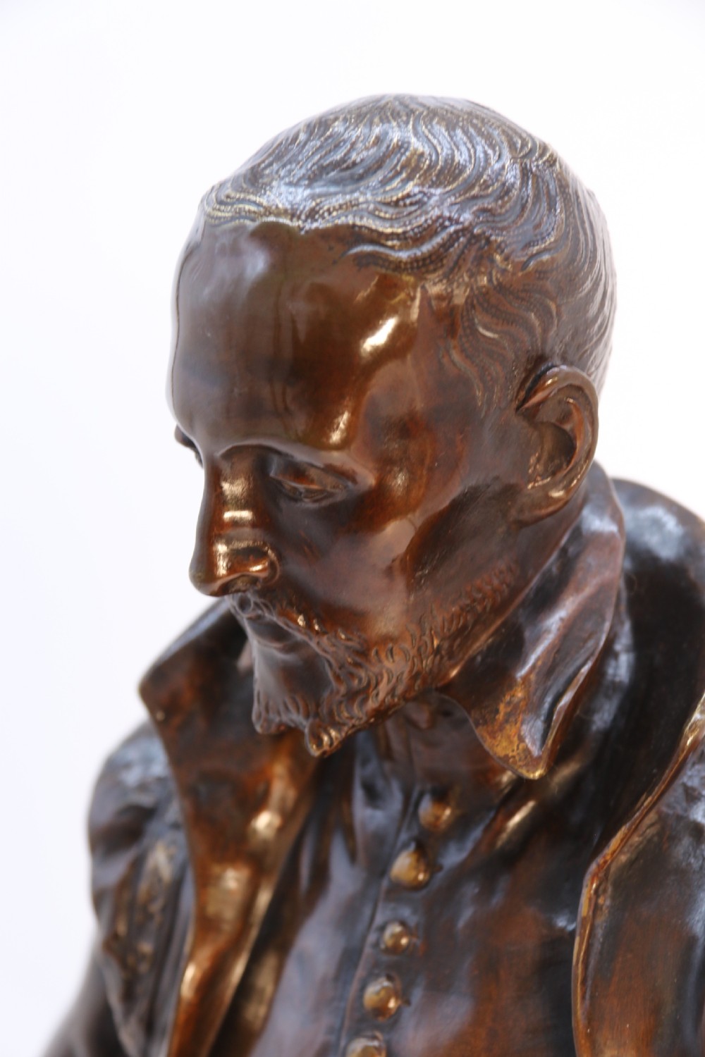 A 19th-century dark patinated bronze figure depicting French poet Joachim de Bellay in 16th-century period costume. View XVI