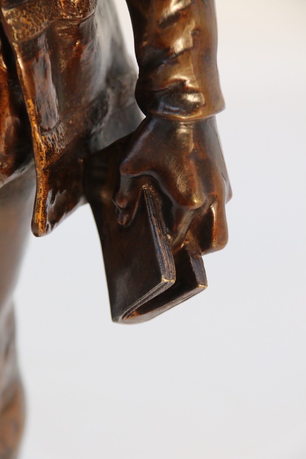 A 19th-century dark patinated bronze figure depicting French poet Joachim de Bellay in 16th-century period costume. View XIX