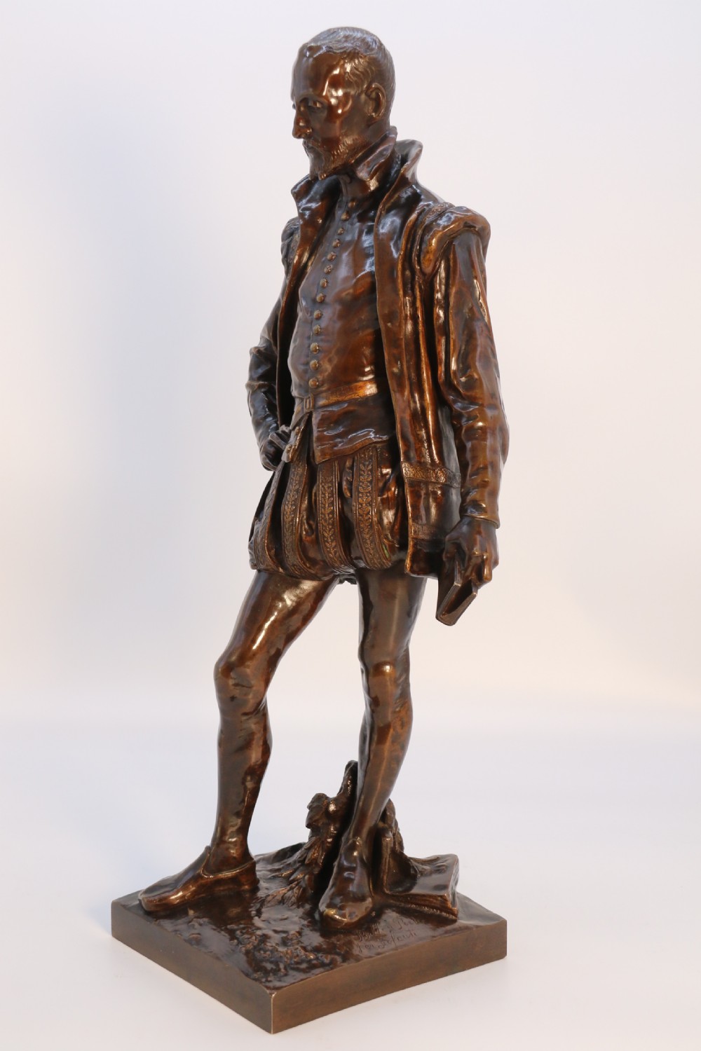A 19th-century dark patinated bronze figure depicting French poet Joachim de Bellay in 16th-century period costume. View XXII