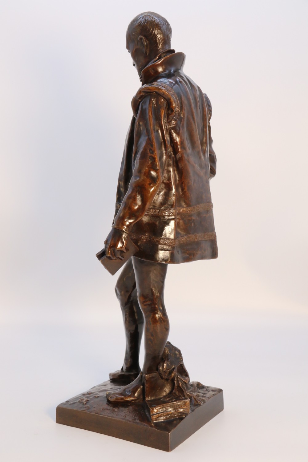 A 19th-century dark patinated bronze figure depicting French poet Joachim de Bellay in 16th-century period costume. View XXIII
