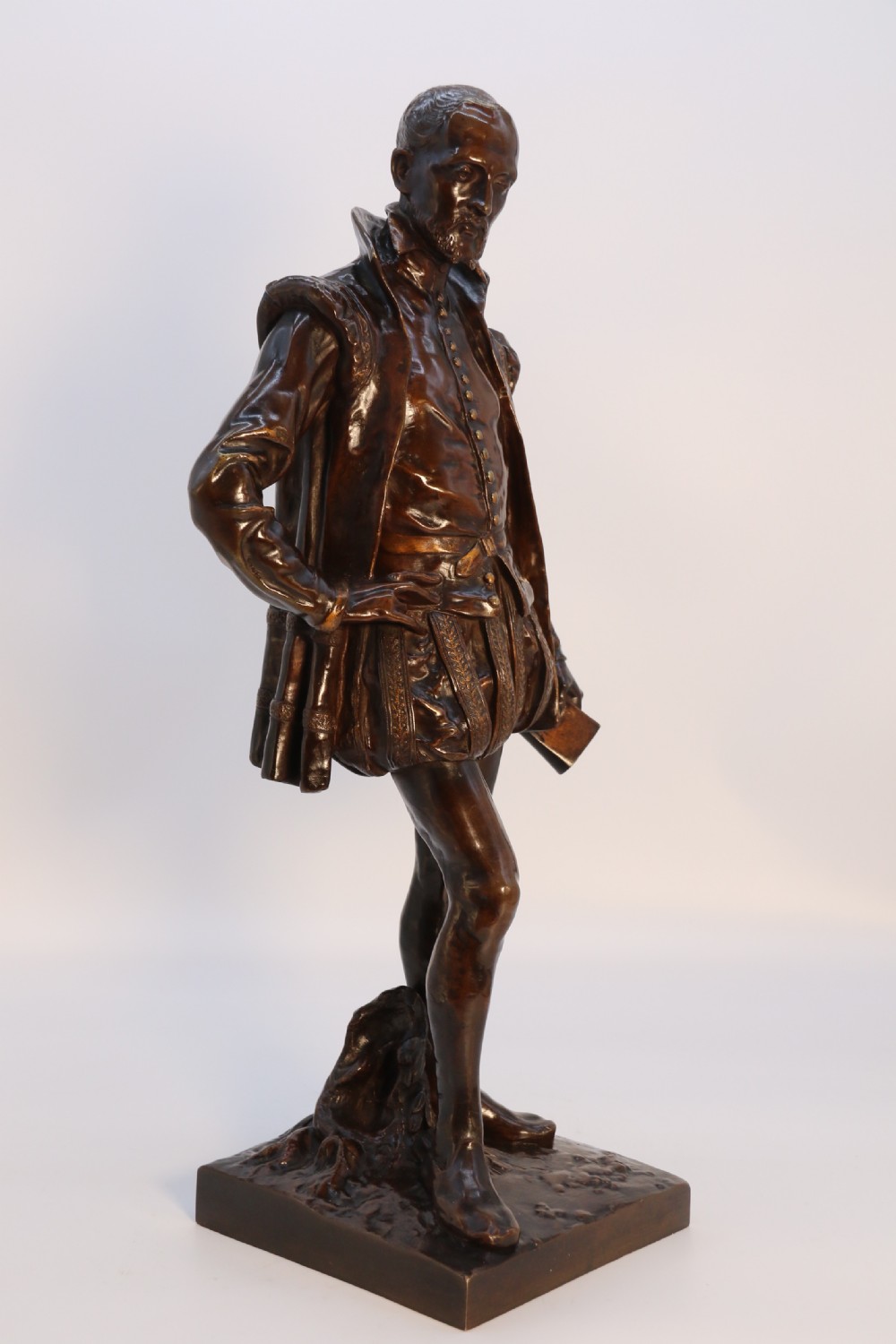 A 19th-century dark patinated bronze figure depicting French poet Joachim de Bellay in 16th-century period costume. View XXV