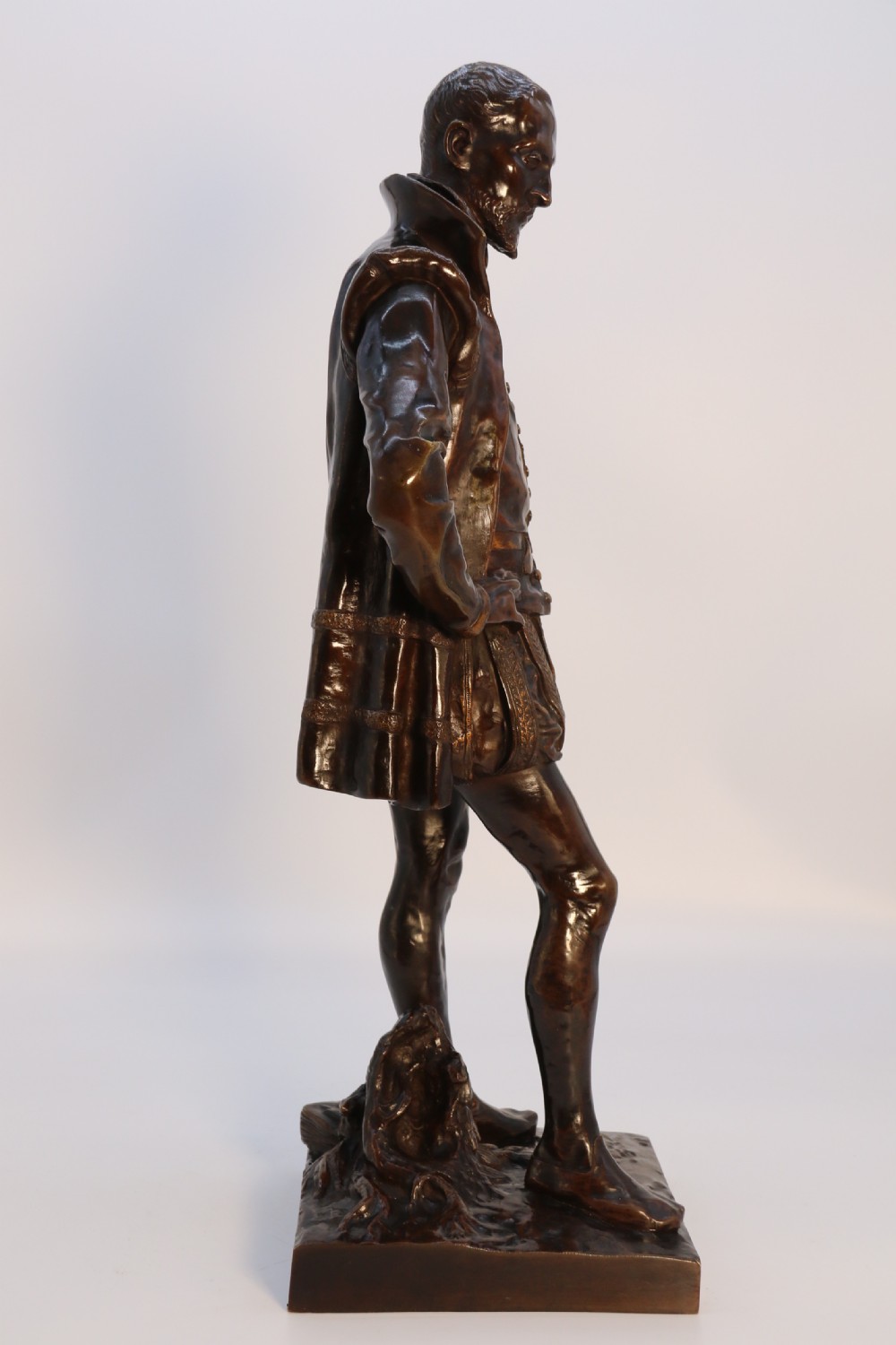 A 19th-century dark patinated bronze figure depicting French poet Joachim de Bellay in 16th-century period costume. View XXVIII