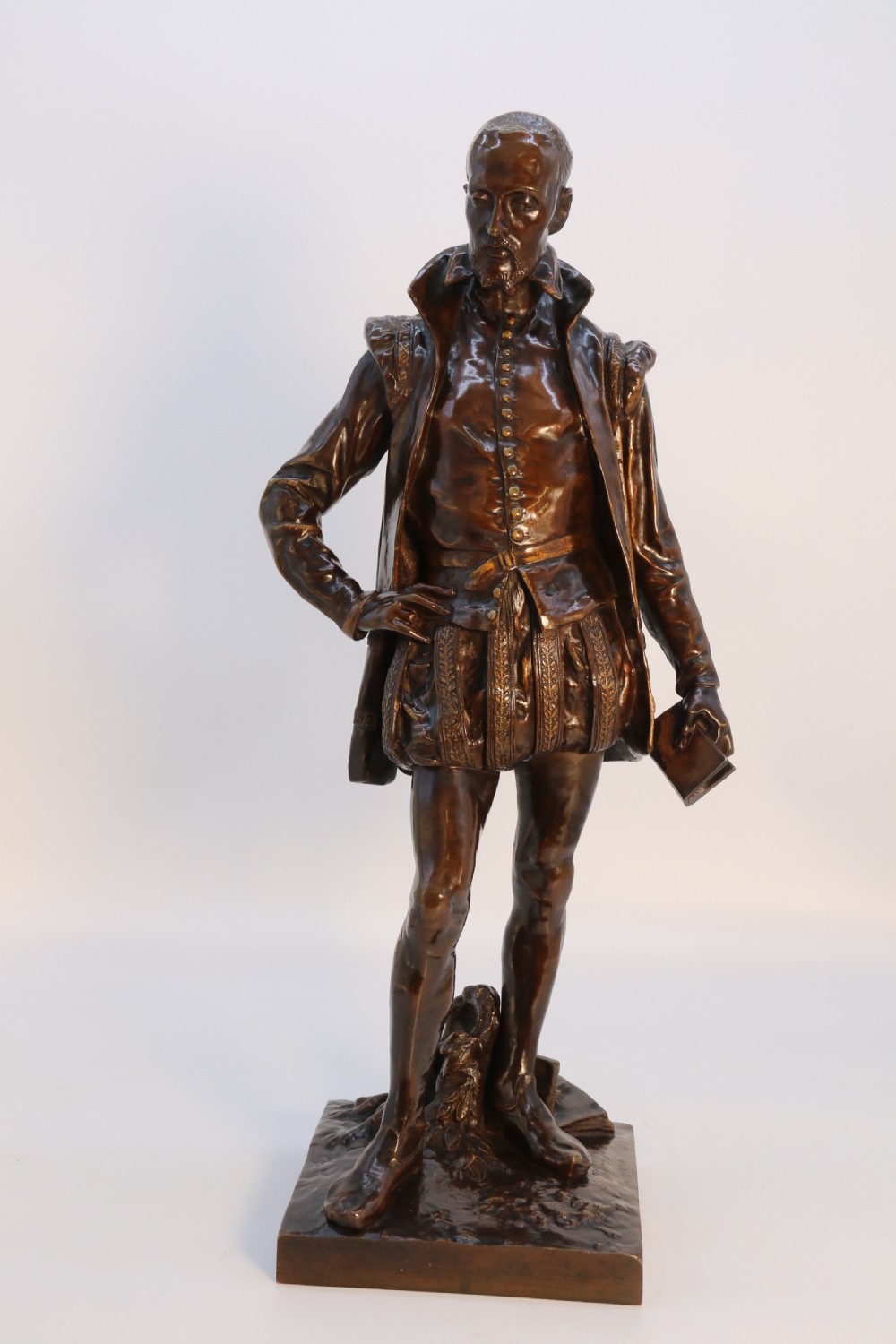 A 19th-century dark patinated bronze figure depicting French poet Joachim de Bellay in 16th-century period costume. View XXIX