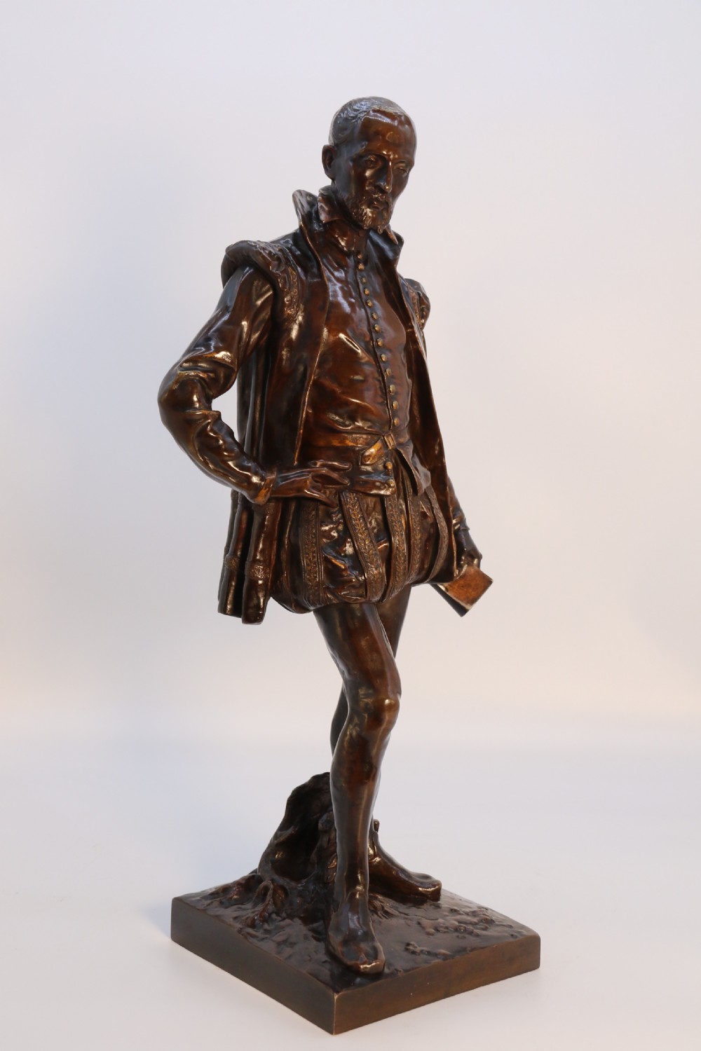 A 19th-century dark patinated bronze figure depicting French poet Joachim de Bellay in 16th-century period costume. View XXX