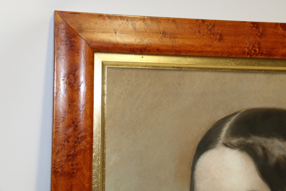 A mid-19th-century pastel portrait of a young woman with ringlets, presented in a rich burl wood frame with a gilt inner slip. View III