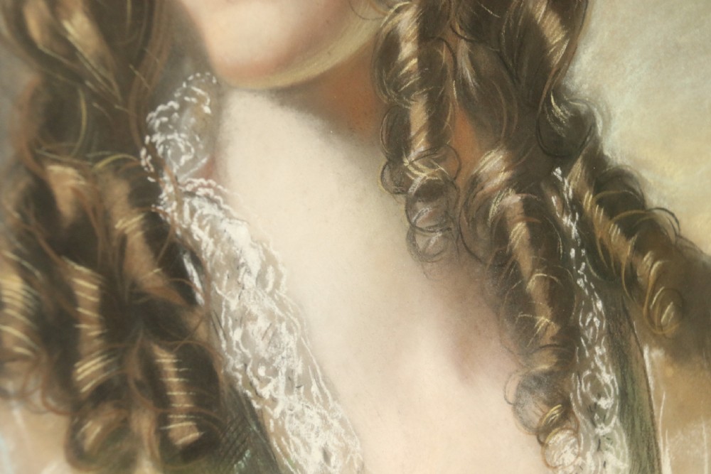 A mid-19th-century pastel portrait of a young woman with ringlets, presented in a rich burl wood frame with a gilt inner slip. View VI