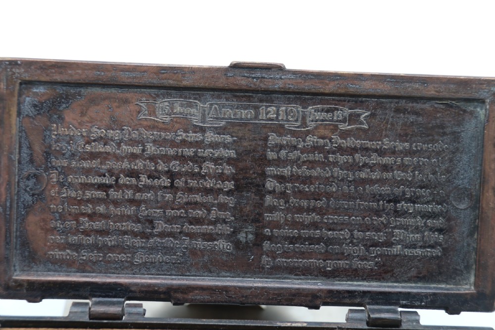 A dark brown patinated cast metal trinket box fashioned in the form of a medieval coffer with relief figures and metal strapwork details. View XIII