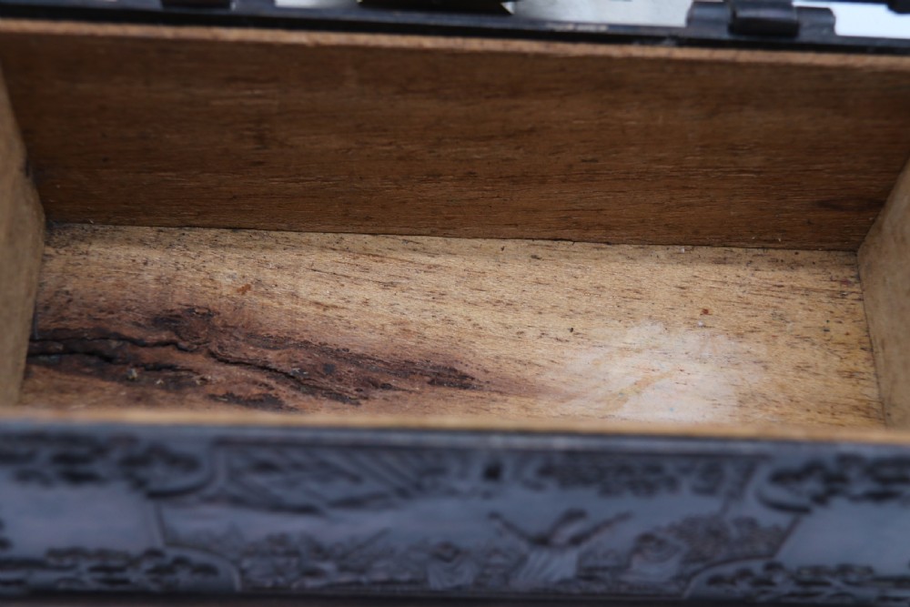 A dark brown patinated cast metal trinket box fashioned in the form of a medieval coffer with relief figures and metal strapwork details. View XV