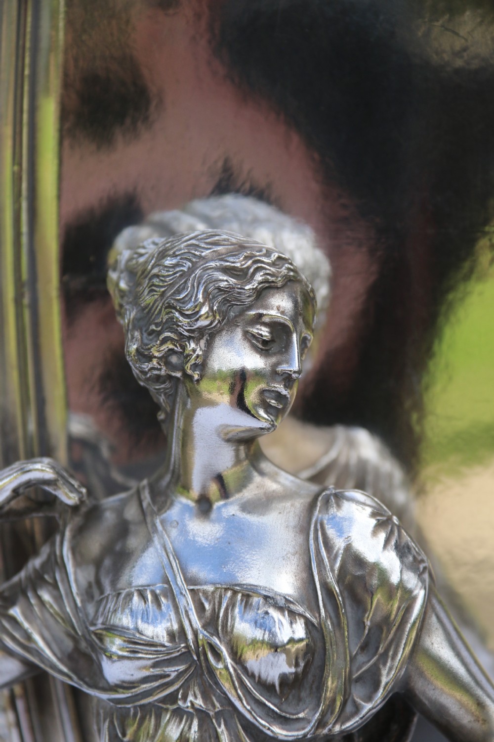 An Art Nouveau silver-plated WMF vase featuring a sculpted maiden figure in relief, sweeping organic handles, and a cut glass rim insert. View III
