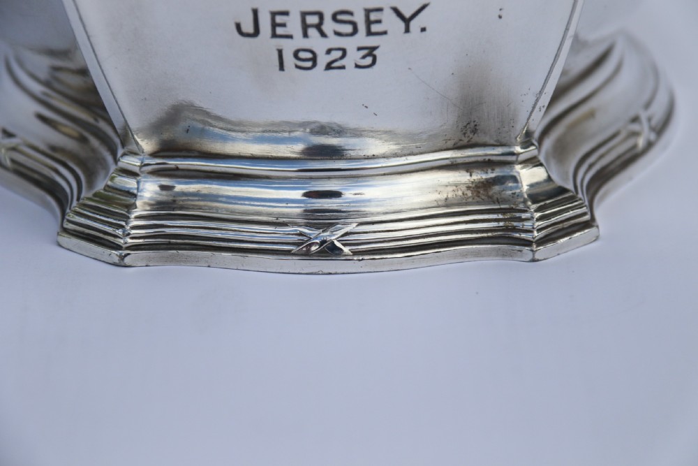 An Art Nouveau silver-plated WMF vase featuring a sculpted maiden figure in relief, sweeping organic handles, and a cut glass rim insert. View VII