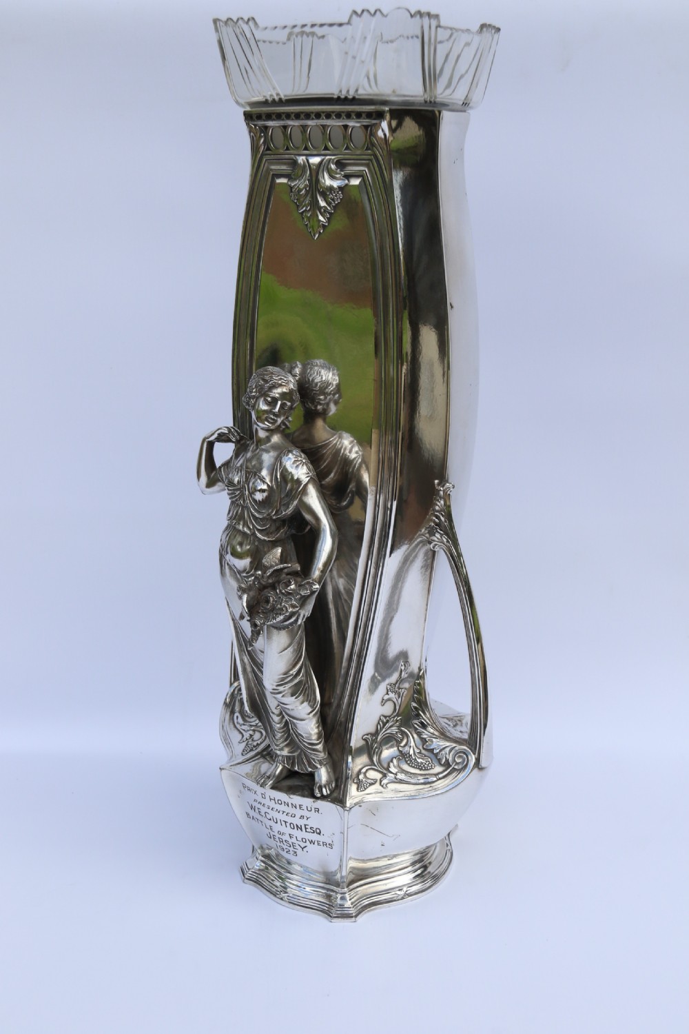 An Art Nouveau silver-plated WMF vase featuring a sculpted maiden figure in relief, sweeping organic handles, and a cut glass rim insert. View VIII