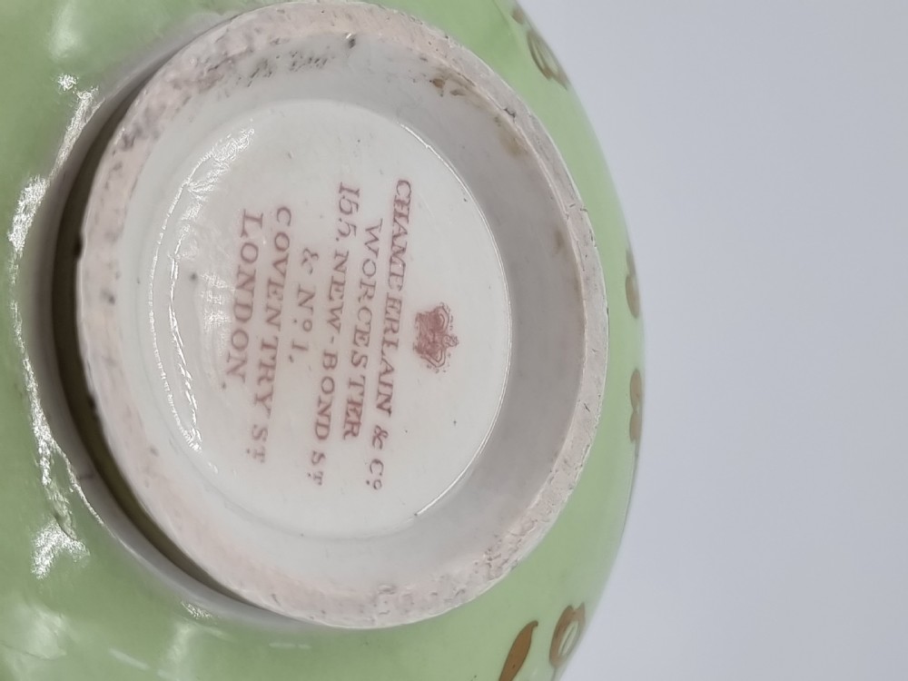 A Chamberlain and Co. Worcester porcelain vase hand painted with a floral display. View II