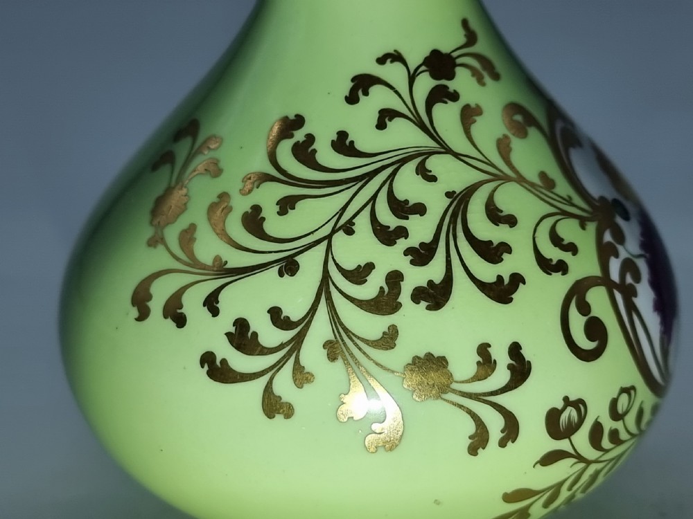 A Chamberlain and Co. Worcester porcelain vase hand painted with a floral display. View XVIII