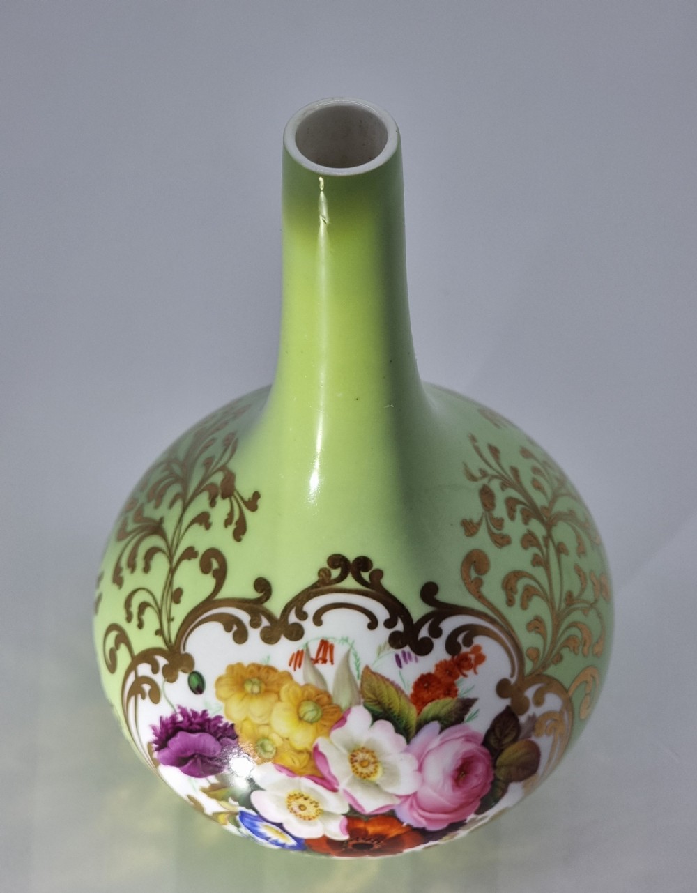 A Chamberlain and Co. Worcester porcelain vase hand painted with a floral display. View XIX