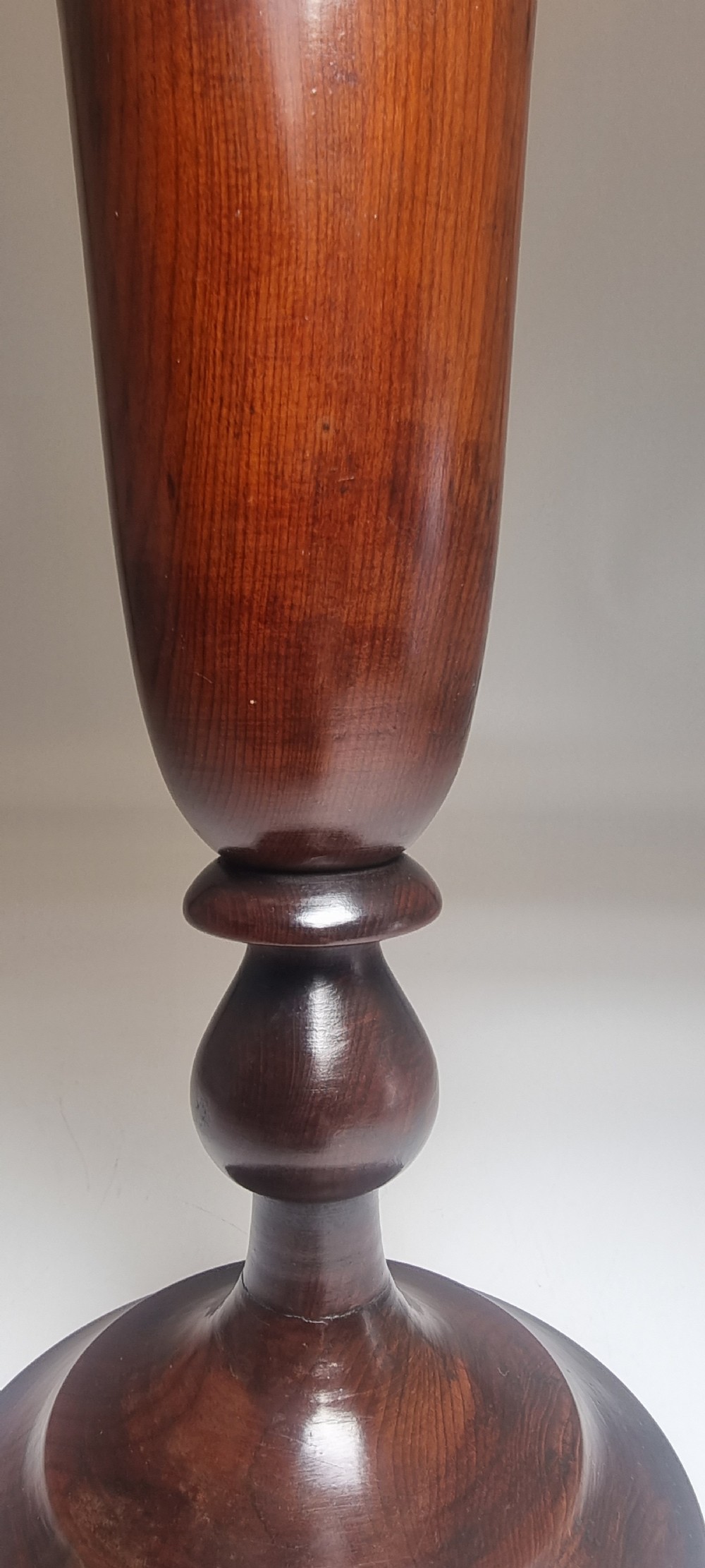 A pair of turned 18th-century yew wood treen vases with flared rims, turned stems, and stepped circular bases. View XVI