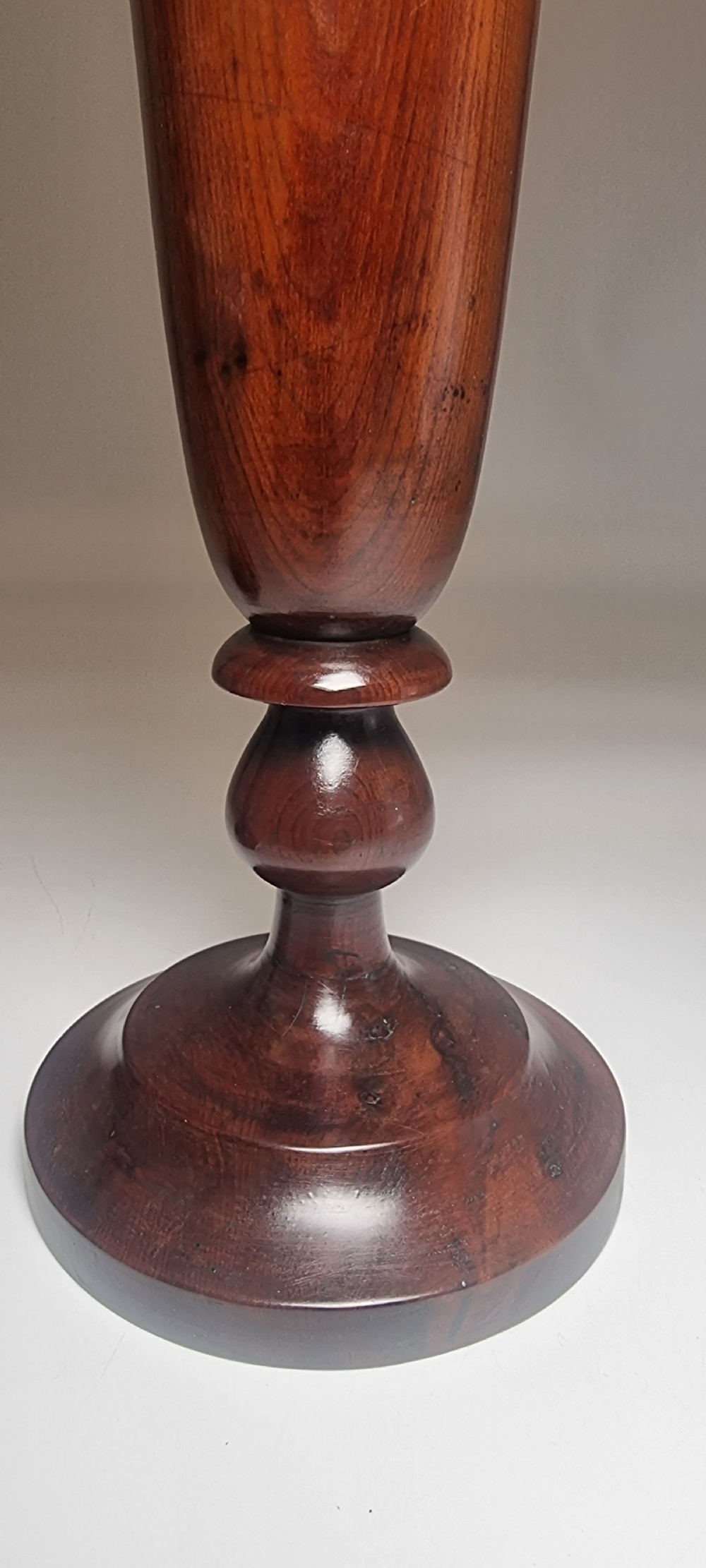 A pair of turned 18th-century yew wood treen vases with flared rims, turned stems, and stepped circular bases. View XVII