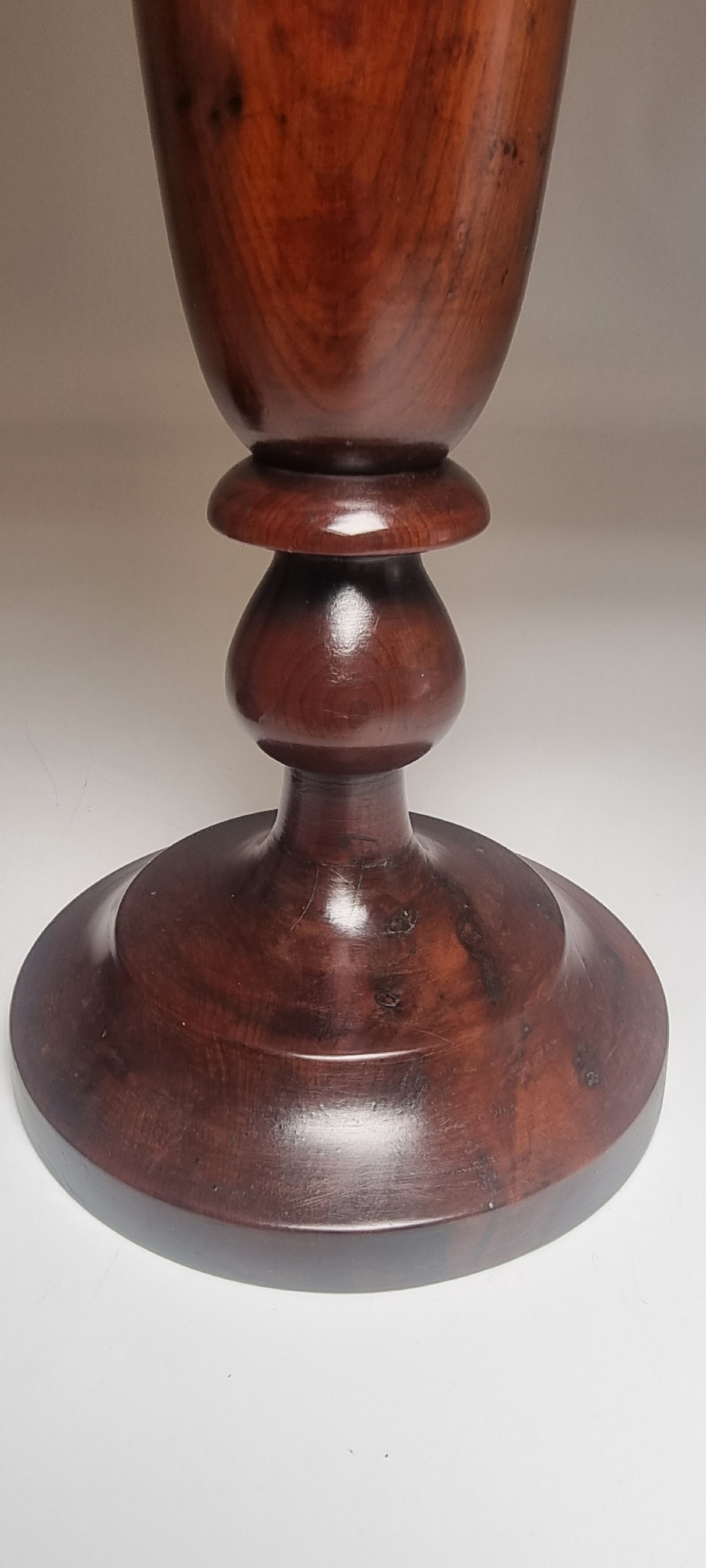 A pair of turned 18th-century yew wood treen vases with flared rims, turned stems, and stepped circular bases. View XVIII