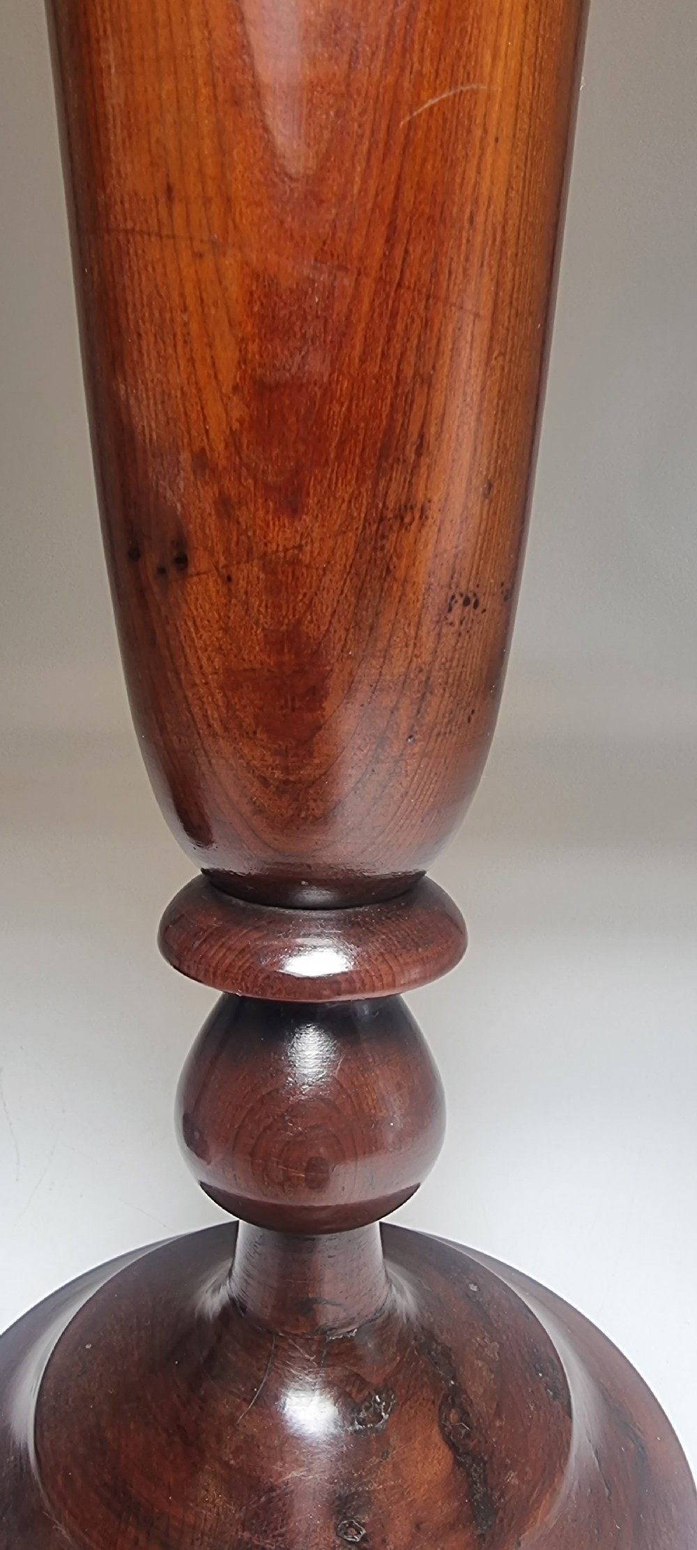 A pair of turned 18th-century yew wood treen vases with flared rims, turned stems, and stepped circular bases. View XIX