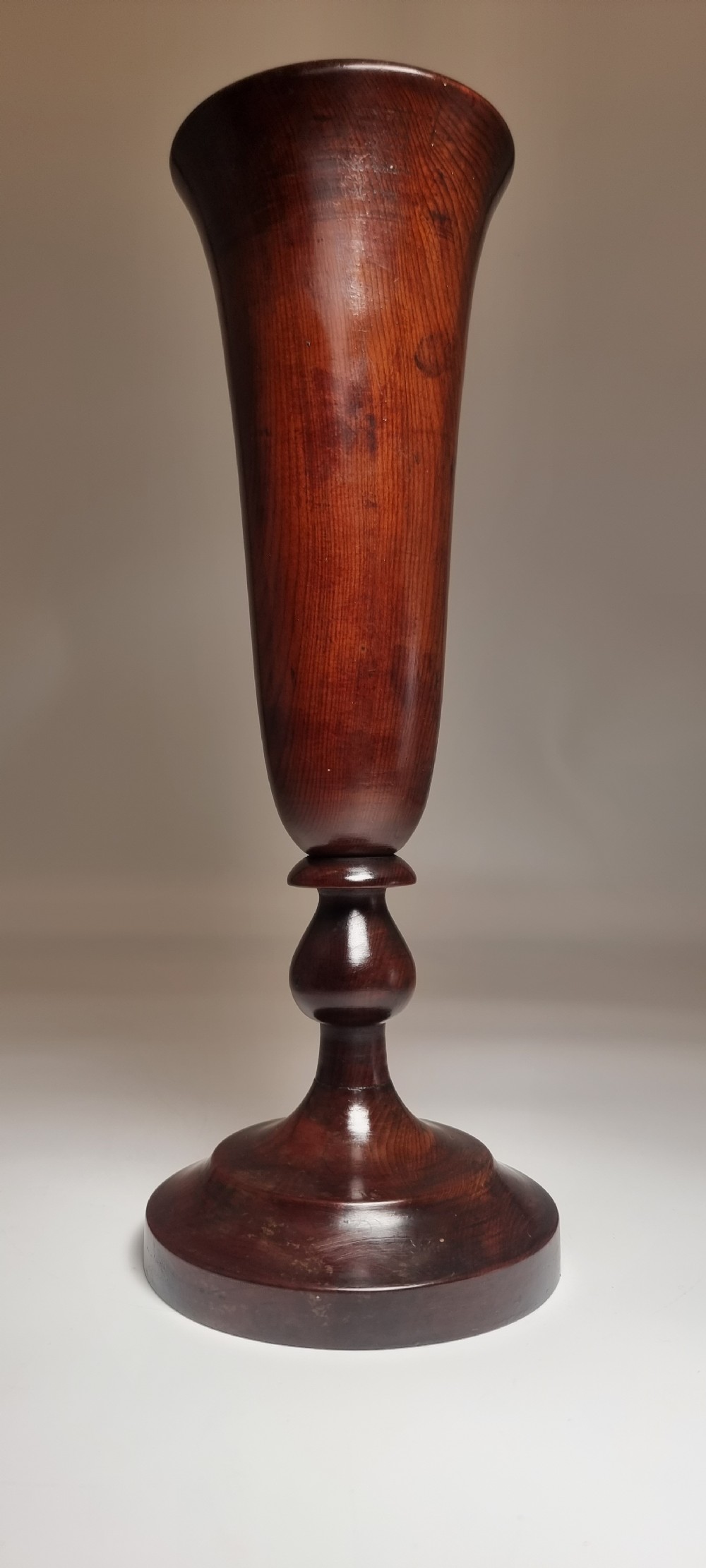 A pair of turned 18th-century yew wood treen vases with flared rims, turned stems, and stepped circular bases. View XX