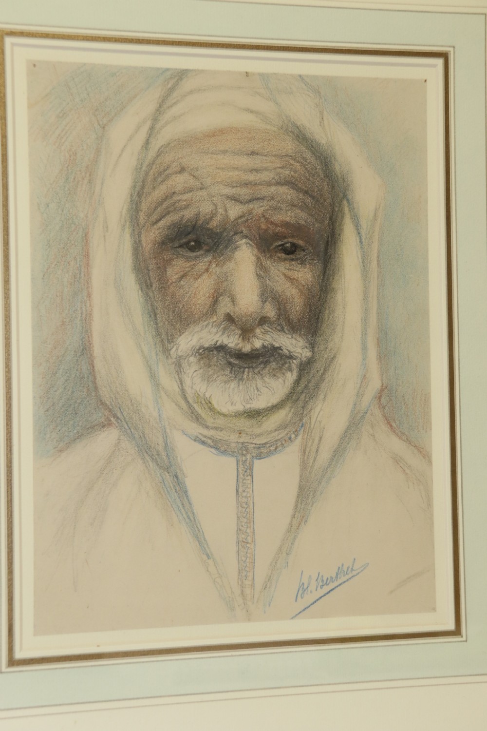 A framed late 19th-century portrait drawing on cream paper depicting an elderly Arabian man wearing a white hooded tunic. View III