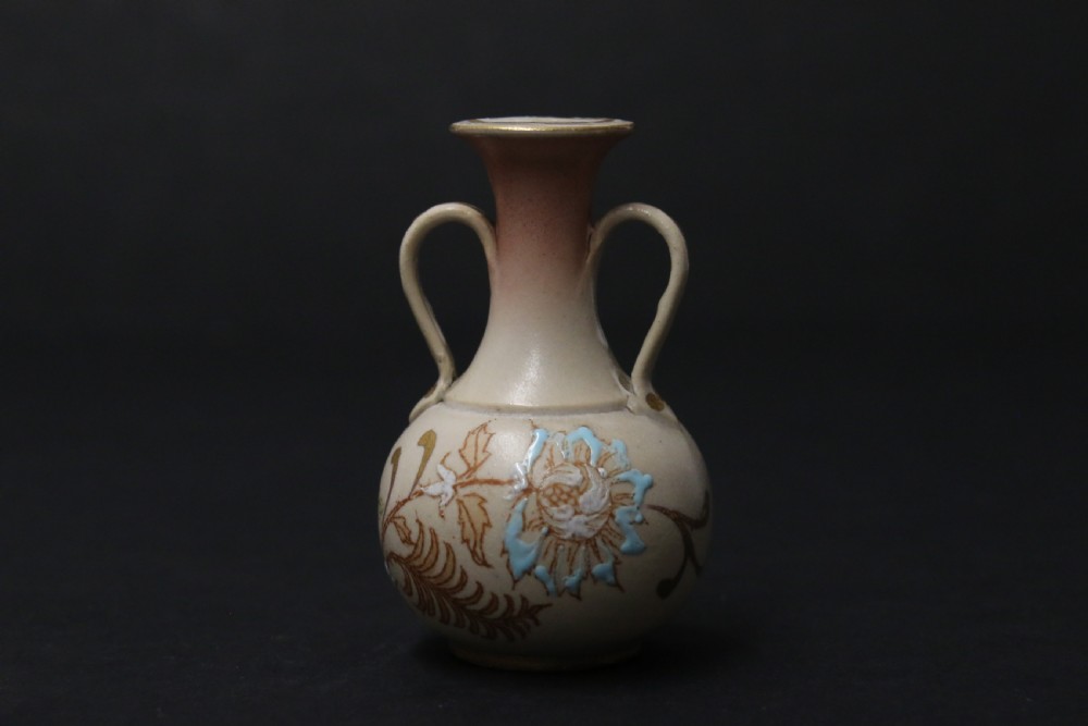 A set of three antique miniature cream ceramic vases featuring hand-painted floral motifs in blue, green, and brown with gilded highlights. View XI
