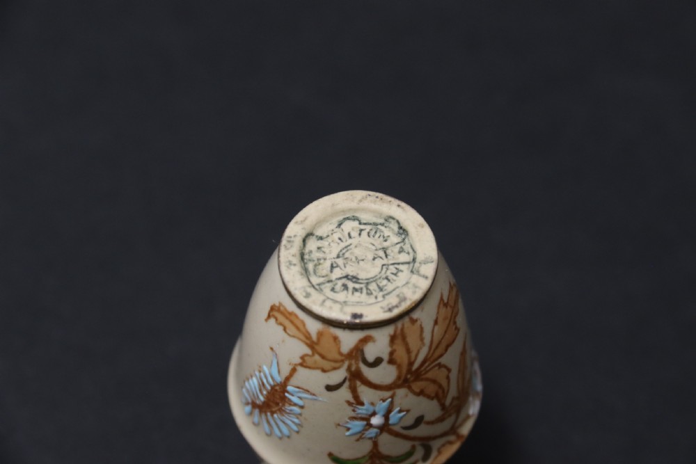 A set of three antique miniature cream ceramic vases featuring hand-painted floral motifs in blue, green, and brown with gilded highlights. View XXV