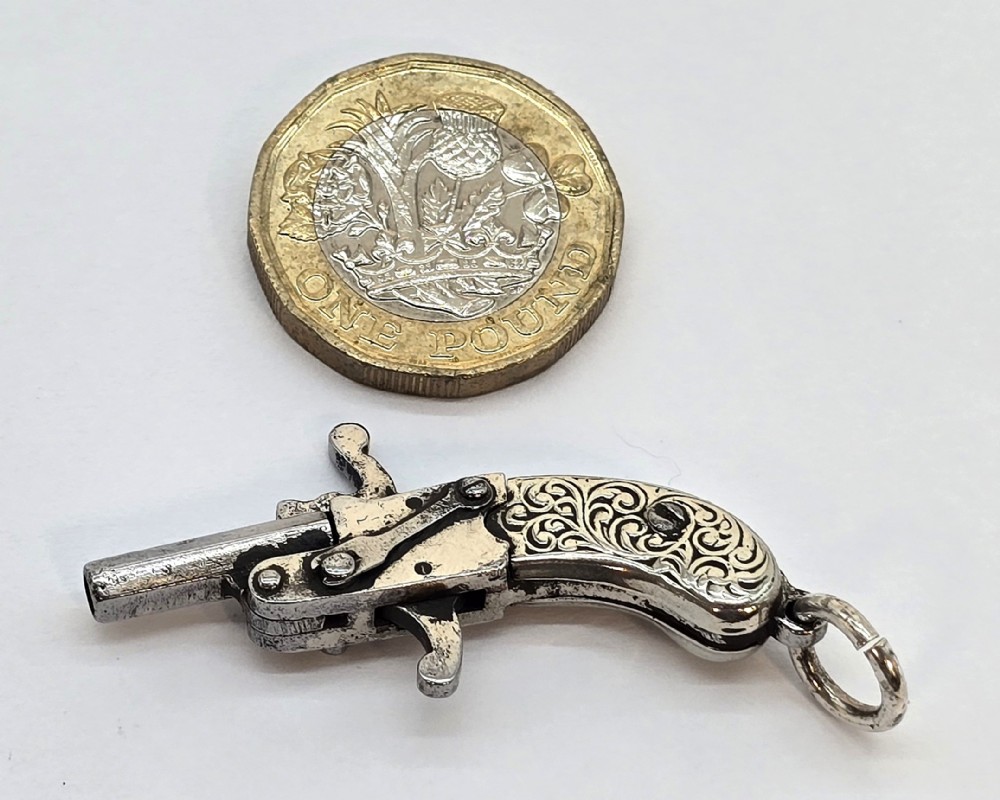 A superb pocket watch chain fob in the form of a flintlock pistol


