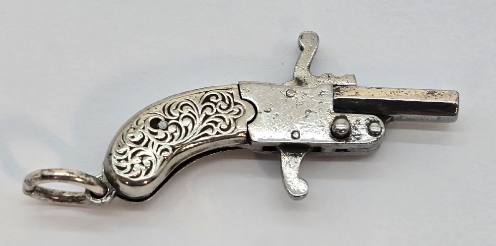 A superb pocket watch chain fob in the form of a flintlock pistol

 View III