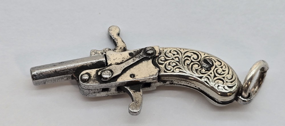 A superb pocket watch chain fob in the form of a flintlock pistol

 View IV
