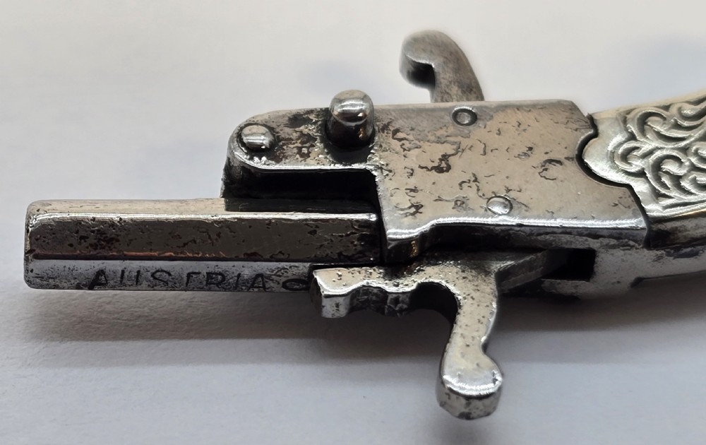 A superb pocket watch chain fob in the form of a flintlock pistol

 View VIII