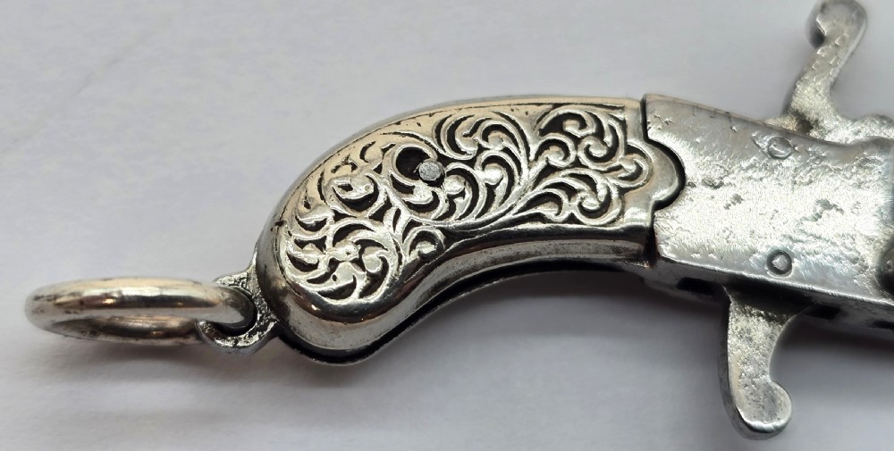 A superb pocket watch chain fob in the form of a flintlock pistol

 View IX